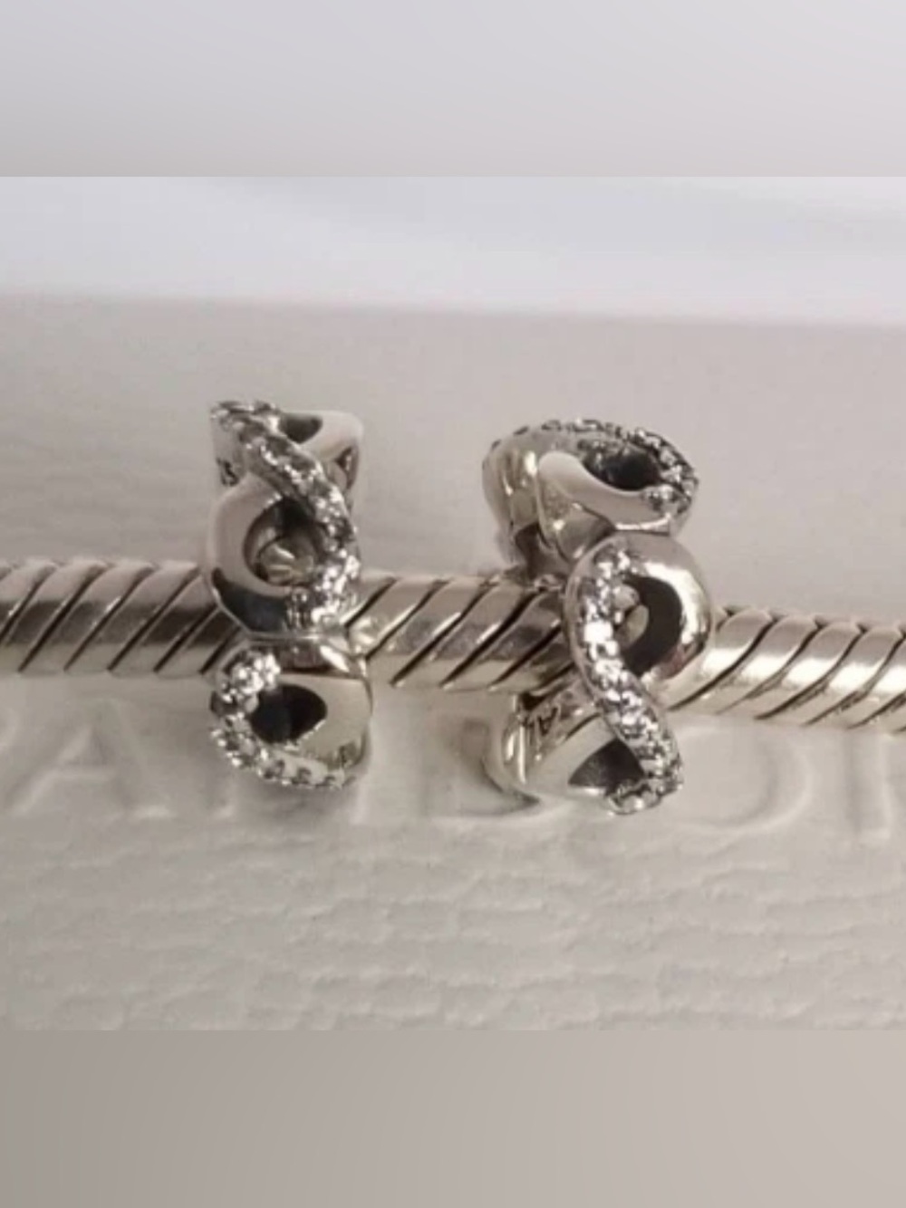 2 Pandora Infinite Love spacer charm featuring a sterling silver